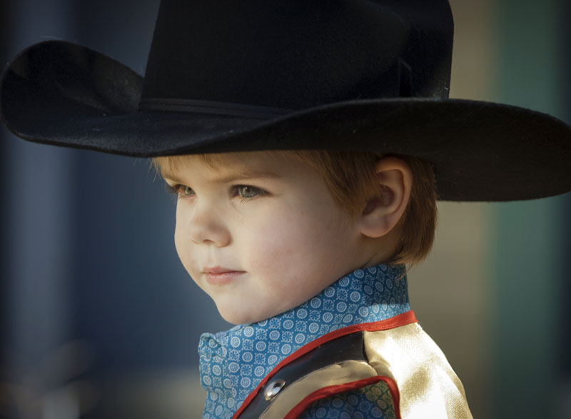 little boy wearing cowboy hat